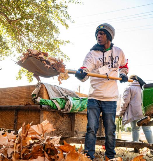 Two students volunteering for community cleanup